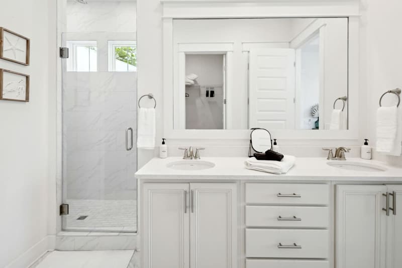 Bathroom with duel vanities and large walk-in shower.