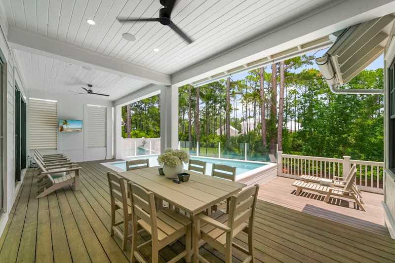 Back deck features dining and lounging areas.