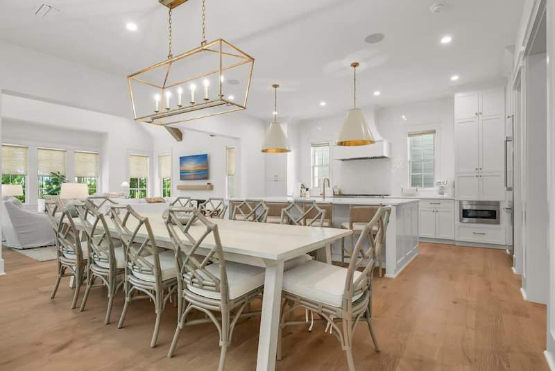Dining room table features seating for 10. Kitchen island includes seating for an additional 4.