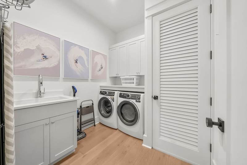 First floor features a large laundry room with full sized washer and dryer.