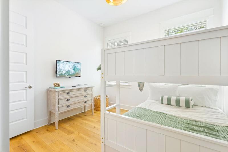Bedroom features a smart tv.