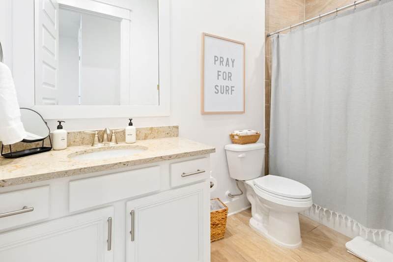 Bathroom features a shower/tub combo.