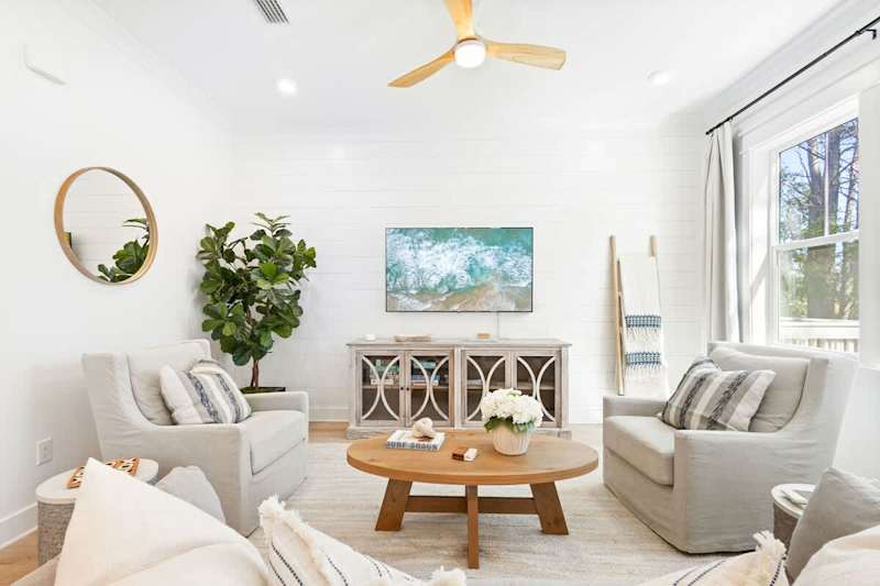 Living room space has a smart tv and plenty of seating for the family!