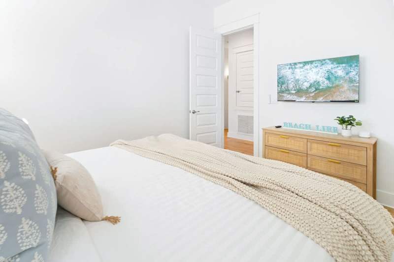 Bedroom features a smart tv.