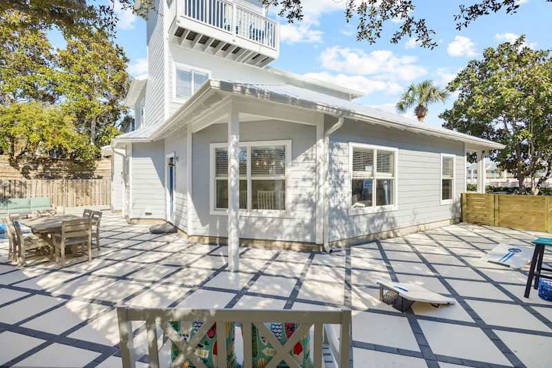 Large, private back yard patio is the perfect place to gather together.