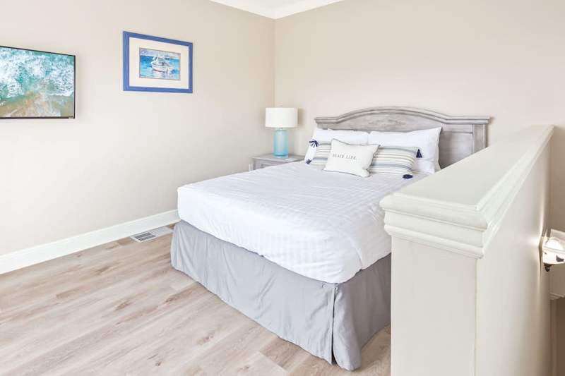 Bedroom #5 features a full bed, smart tv and walkout balcony with gulf views.