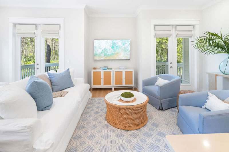 Living room space has a smart tv and plenty of seating for the family!