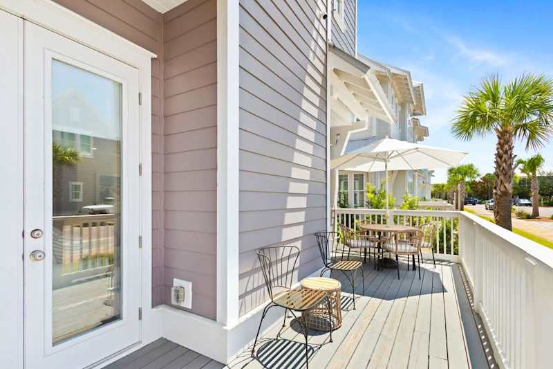 Large private patio off living room with seating.