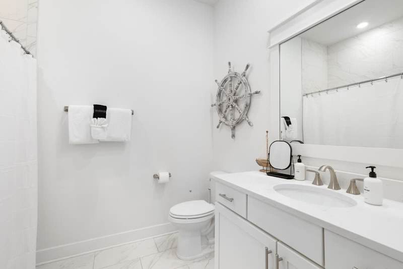 Second floor full bath features a shower/tub combo.