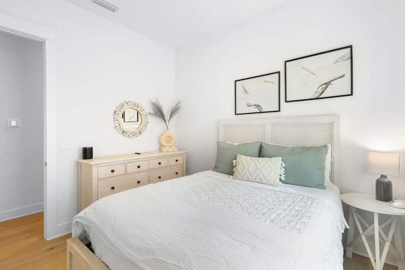 Bedroom #1 features a queen bed and smart tv.
