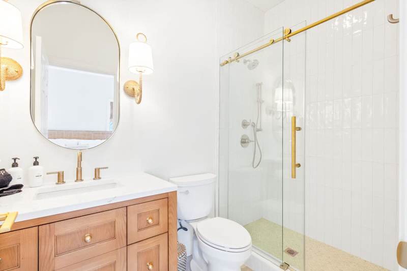 Bathroom with luxurious finishes. Features a walk-in shower.