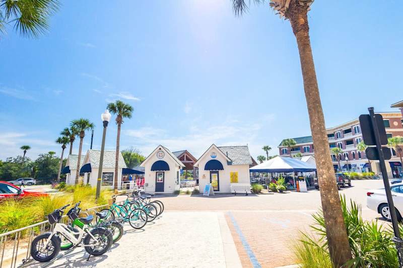 View from the front of the community with bike rentals, local restaurants, ice cream, coffee, & groceries just steps away from the condo!