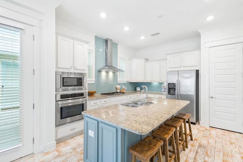 Large kitchen island includes seating for 4.