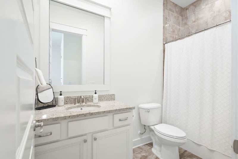 Bathroom features a shower/tub combo.