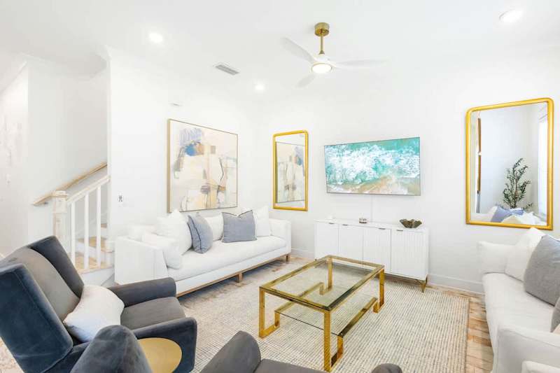 Living room space has a smart tv and plenty of seating for the family!