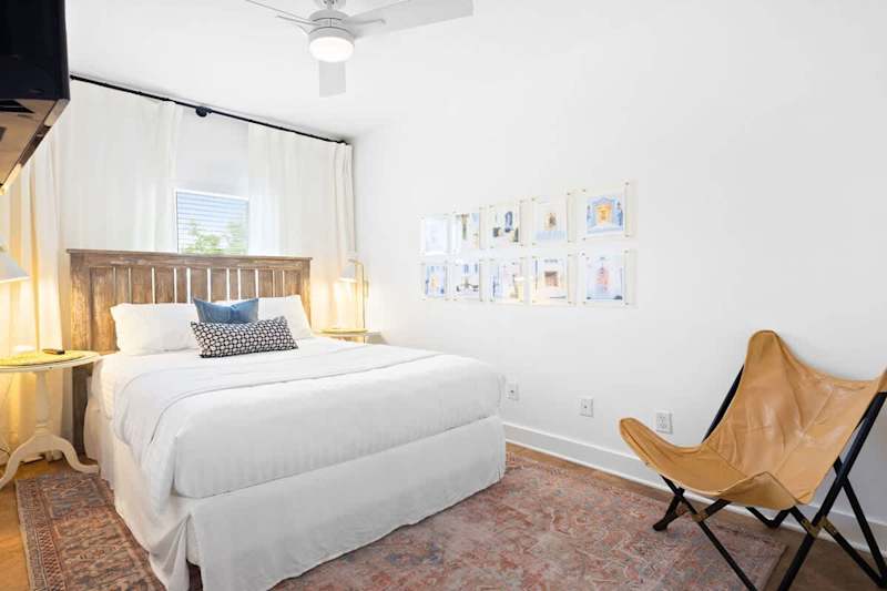 Bedroom #1 features a queen bed and smart tv.