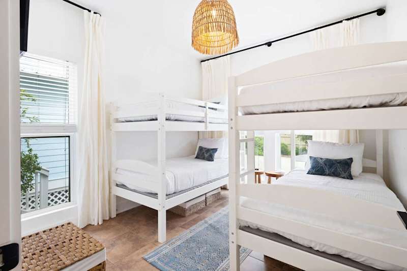 Bedroom #2 features (2) twin over twin bunks and a smart tv.