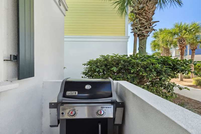 Front porch features a gas grill.