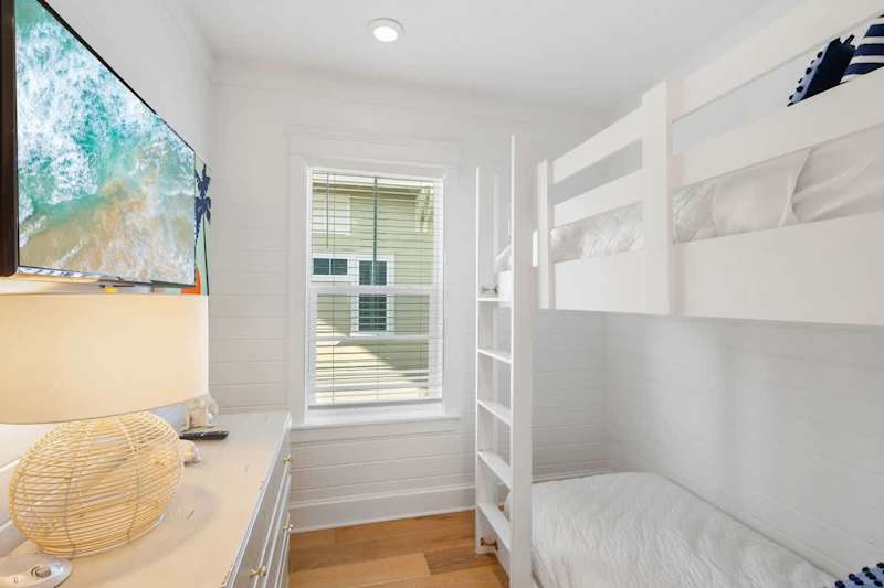 Bedroom #3 features a built-in twin over twin bunk and smart tv.