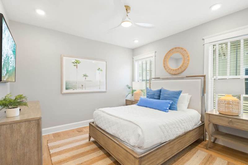 Bedroom #4 features a queen bed and smart tv.