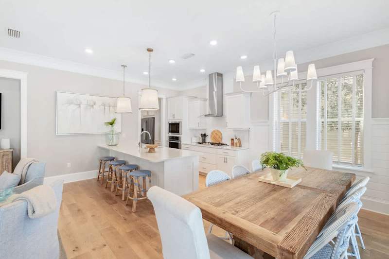 Dining room table feature seating for 8, with an additional 4 seats at the large kitchen island.