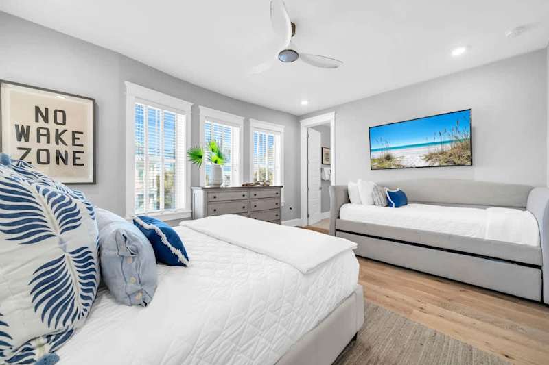 Bedroom #2 features a queen bed, a twin bed with a twin trundle, a smart tv and ensuite.