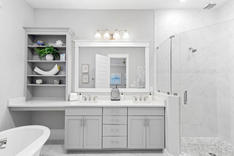 Bathroom features, dual vanities, walk-in shower and soaker tub.
