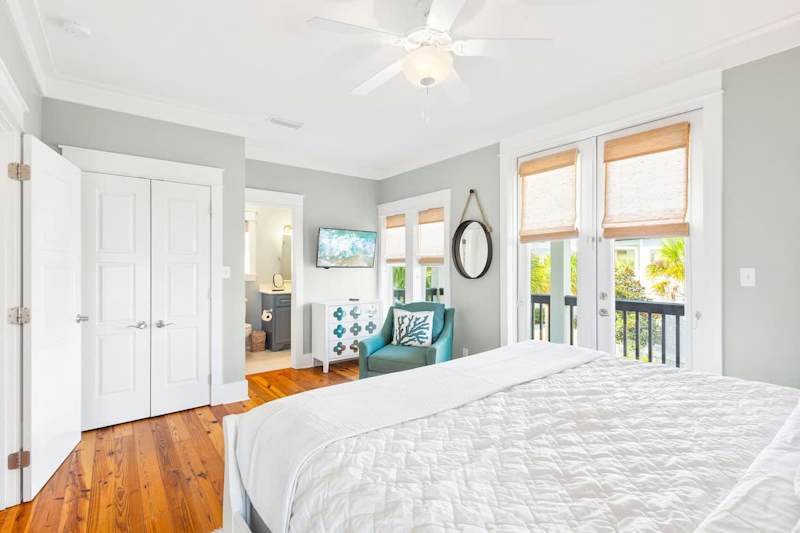 Bedroom includes a walkout to balcony.