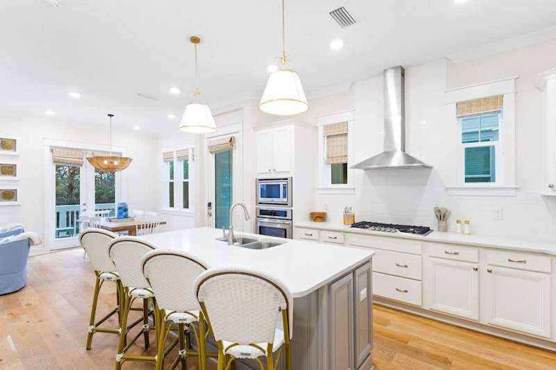 Kitchen island features seating for an additional 4.