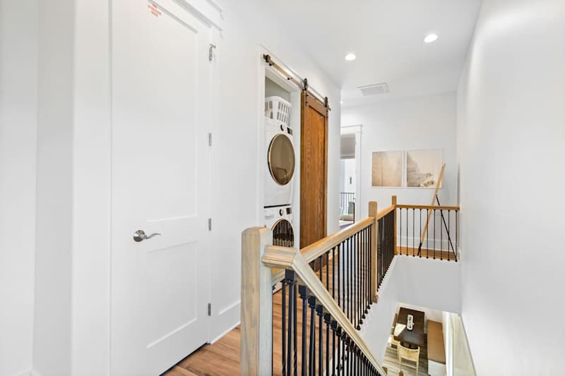 Third floor laundry featuring a full washer and dryer.