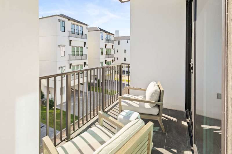 Balcony access off third floor king bedroom and 2nd floor living space.