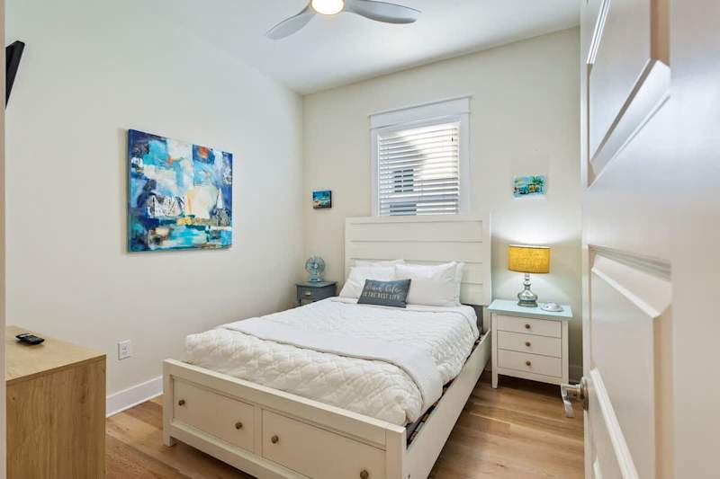 Bedroom #1 features a full bed and smart tv.