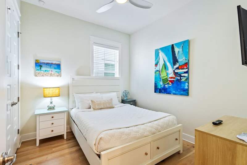 Bedroom #2 features a queen bed and smart tv.
