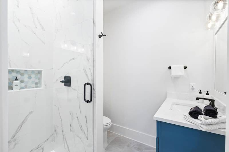 Bathroom features a walk-in shower.
