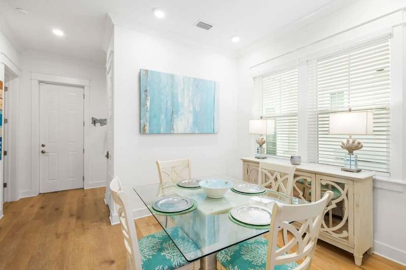 Dining room table features seating for 4.