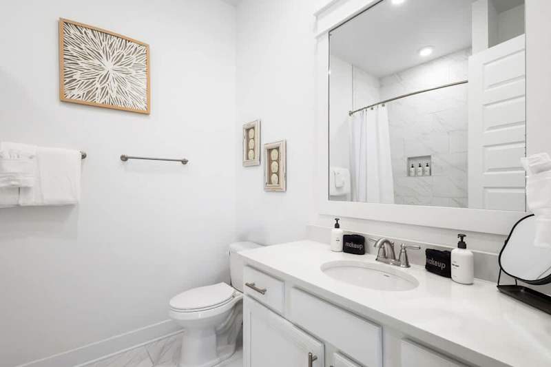 Second floor guest bathroom features a shower/tub combo.