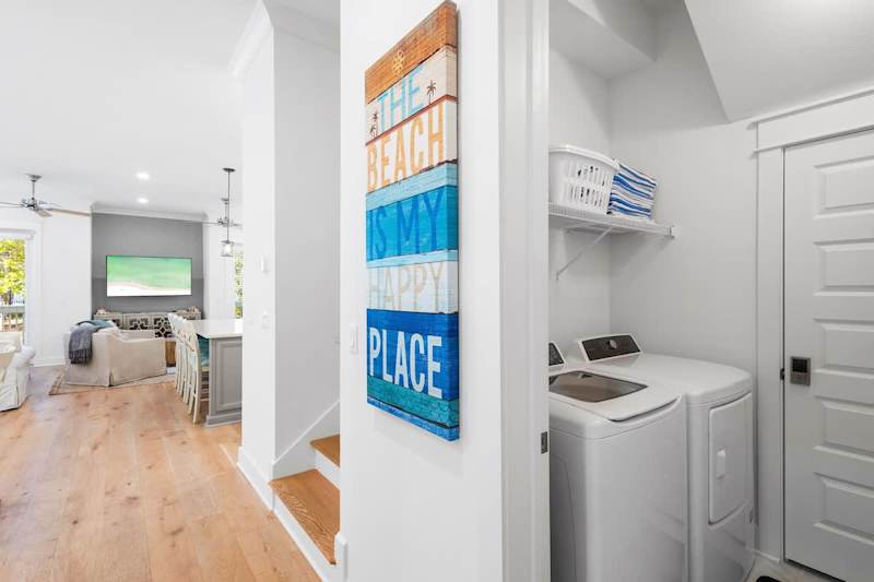 First floor laundry room features a full washer and dryer.