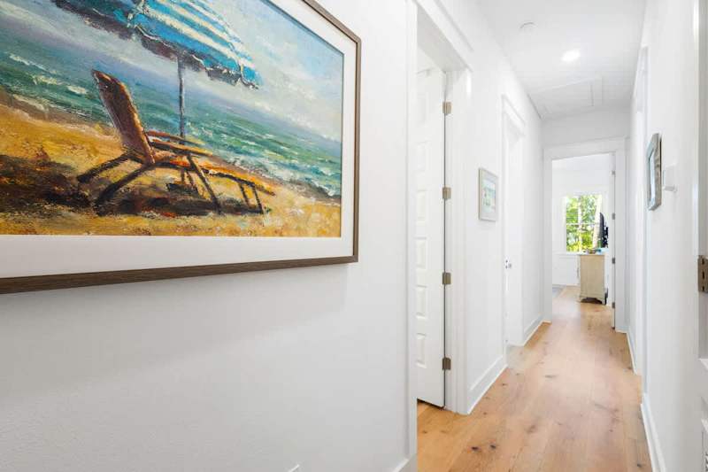 Second floor hallway leads to the homes three bedrooms.