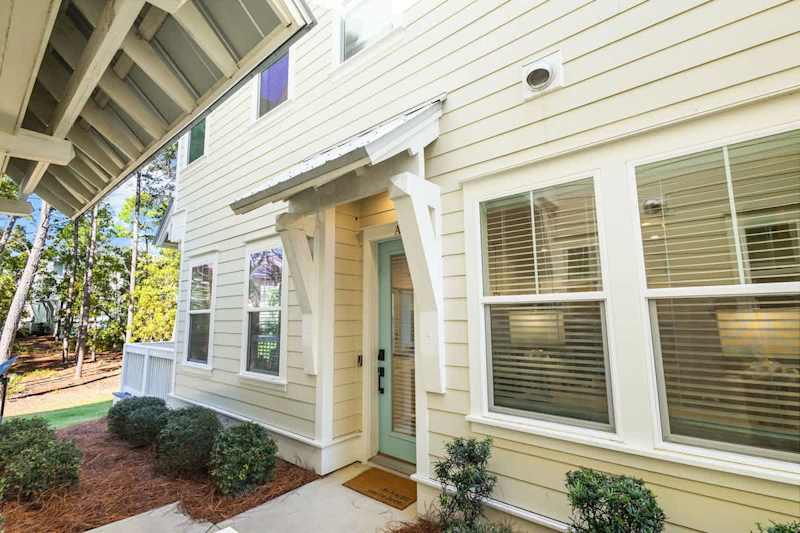 Entrance to home is located on the lefthand side past the driveway.