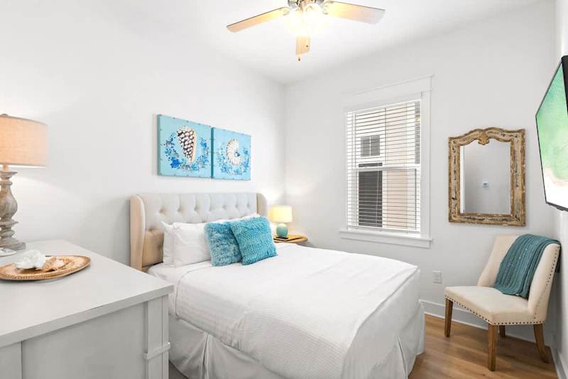 Bedroom #1 features a queen bed and smart tv.