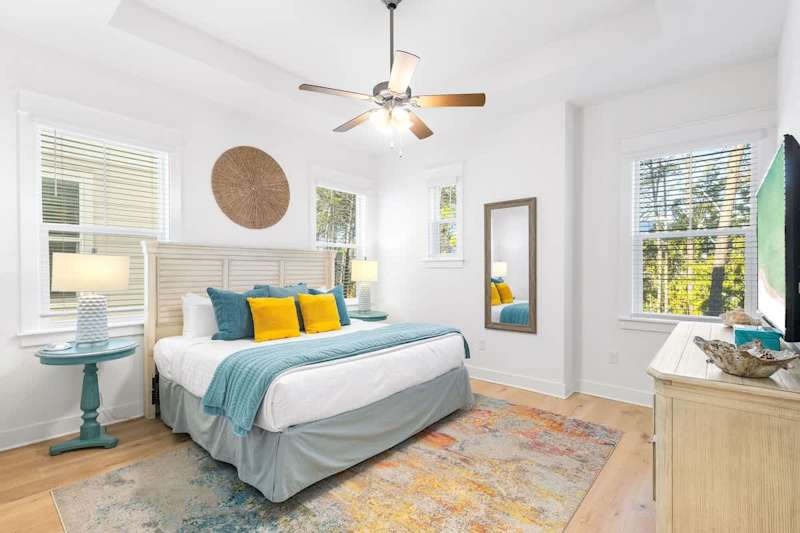 Bedroom #3 features a king bed, ensures and smart tv.