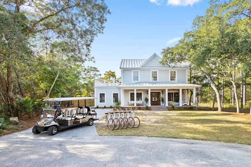 Home features a 6-seater golf cart, 6 adult bikes and driveway parking for 4!