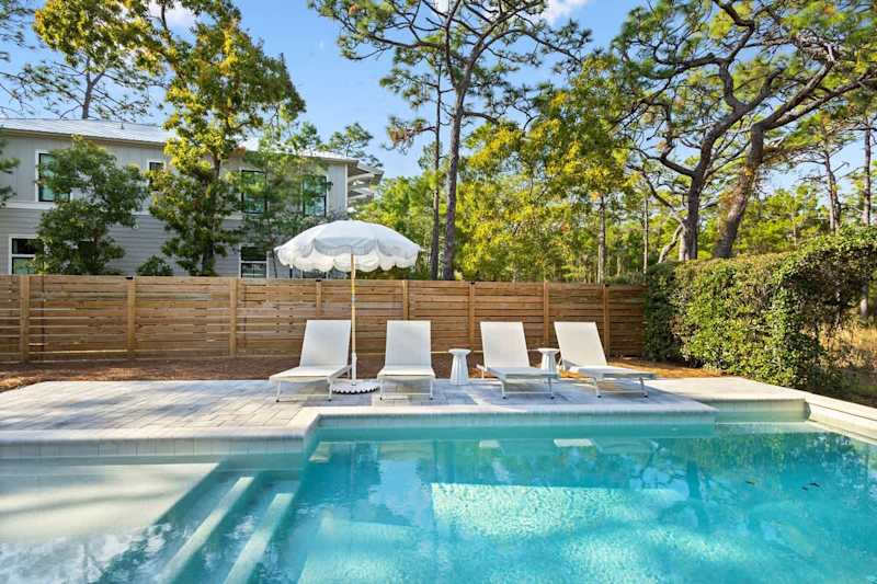 Private pool features sun loungers.
