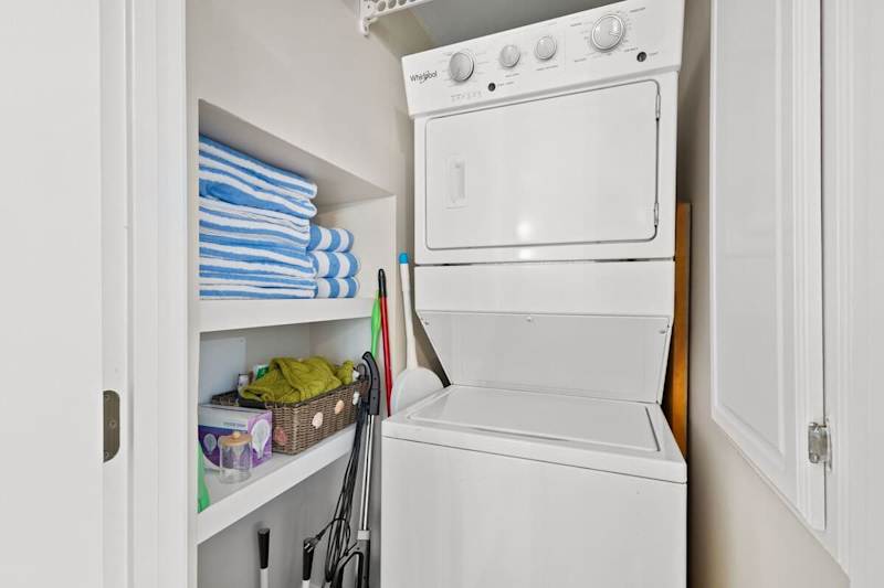 Fist floor features a washer and dryer.
