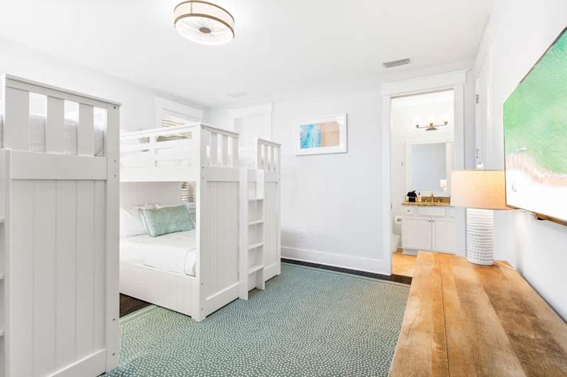 Bedroom #3 features (2) full over full bunks and a smart tv.