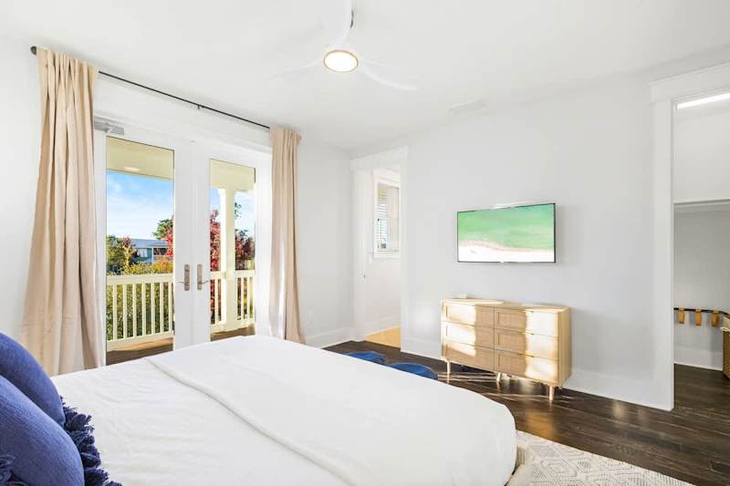 Bedroom #4 features a king bed, smart tv and ensuite. Bedroom features a walkout to balcony.