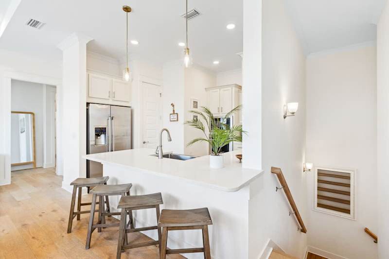 Large kitchen island features seating for an additional 4.