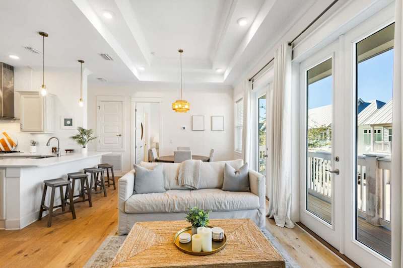 Living room features a walkout to a large private balcony.