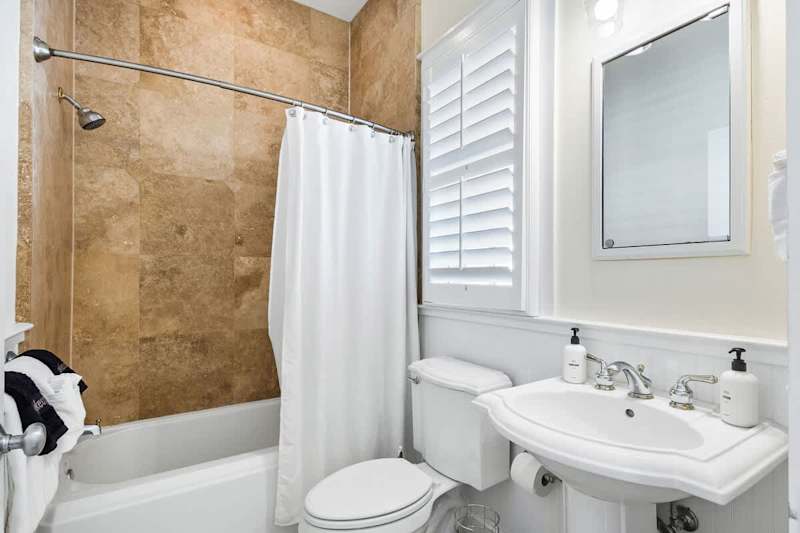 Bathroom features a shower/tub combo.