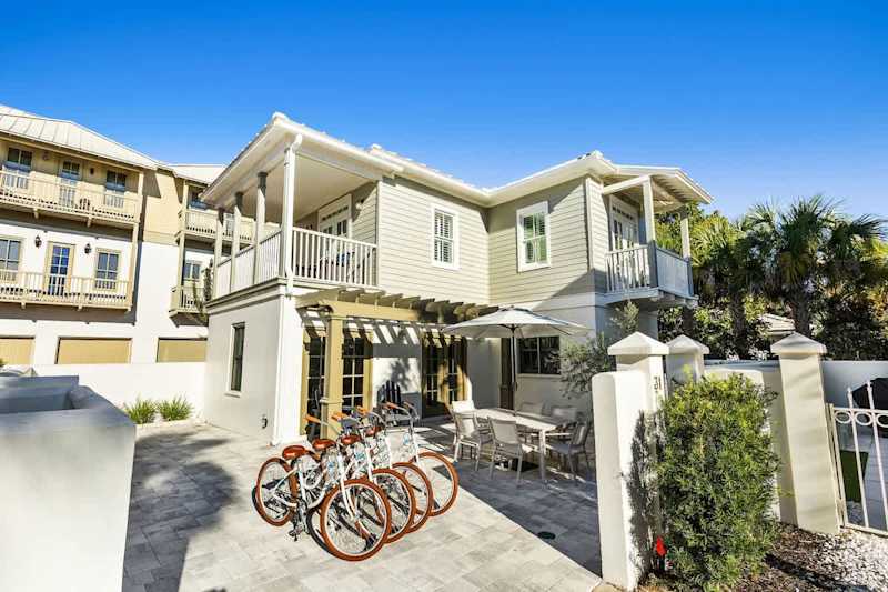 Home includes four adult bikes and two driveway parking spaces.